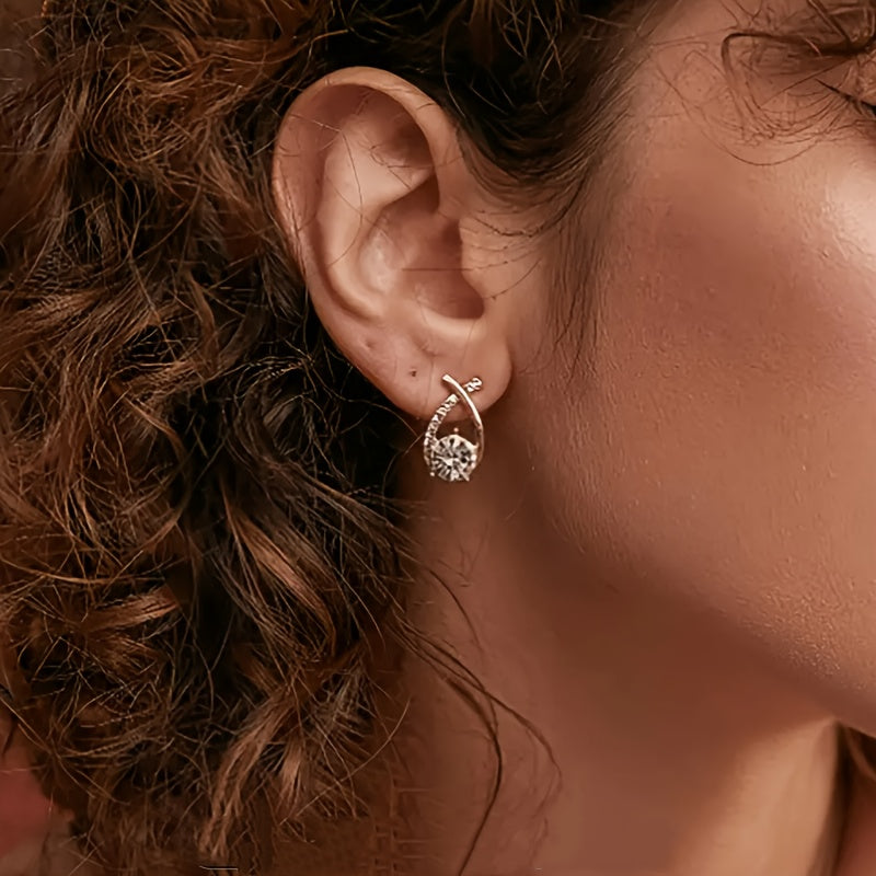 Boucles d'oreilles avec croix dorée et zirconium
