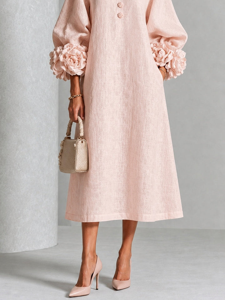 Robe midi rose à fleurs boutonnée avec de superbes poignets fleuris