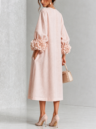 Robe midi rose à fleurs boutonnée avec de superbes poignets fleuris