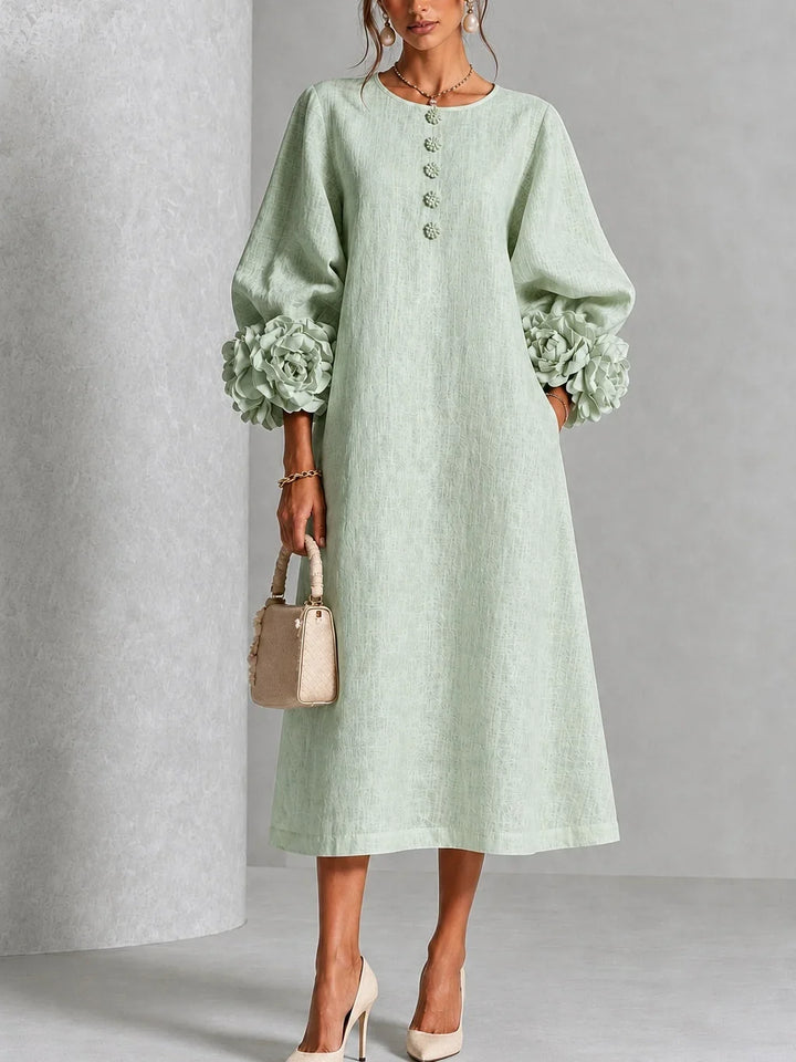 Robe midi rose à fleurs boutonnée avec de superbes poignets fleuris